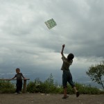 Nepalese children play with a kite