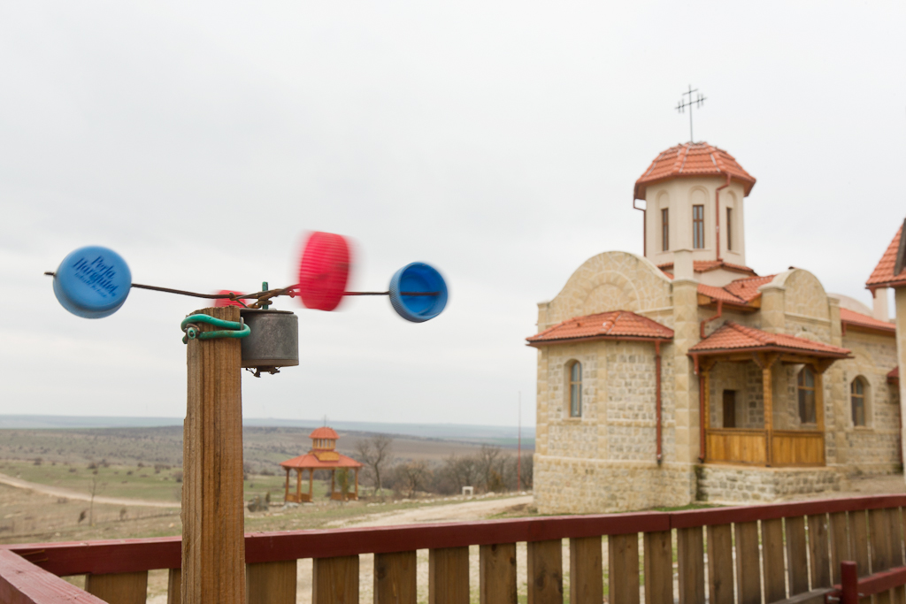 A childs wind toy spins in the wind at the Casian Monastery in Romania.
